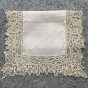 Antique white cotton rectangular table runner with intricate cream lace trim